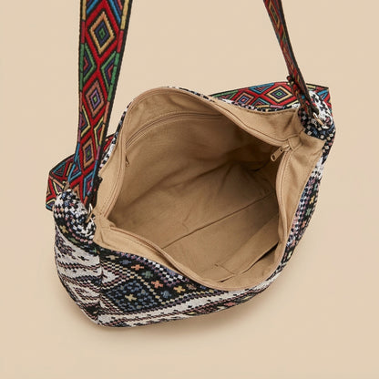 Boho woven shoulder bag with colorful geometric strap