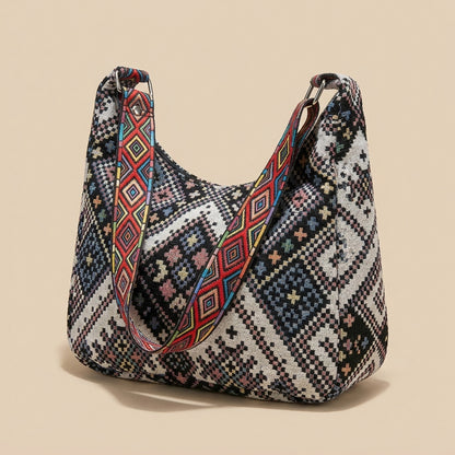 Boho woven shoulder bag with colorful geometric strap