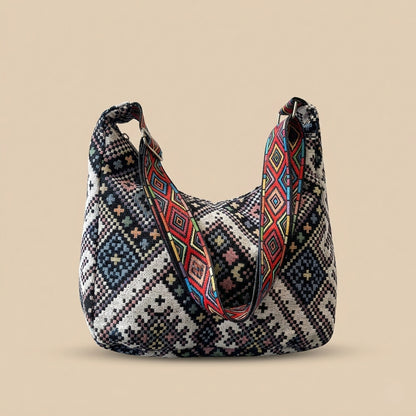 Boho woven shoulder bag with colorful geometric strap