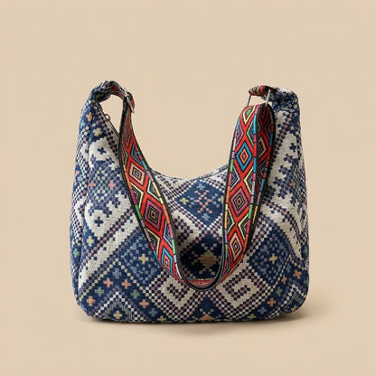 Boho woven shoulder bag with colorful geometric strap
